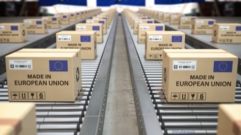 Packages with EU flag on conveyor belt
